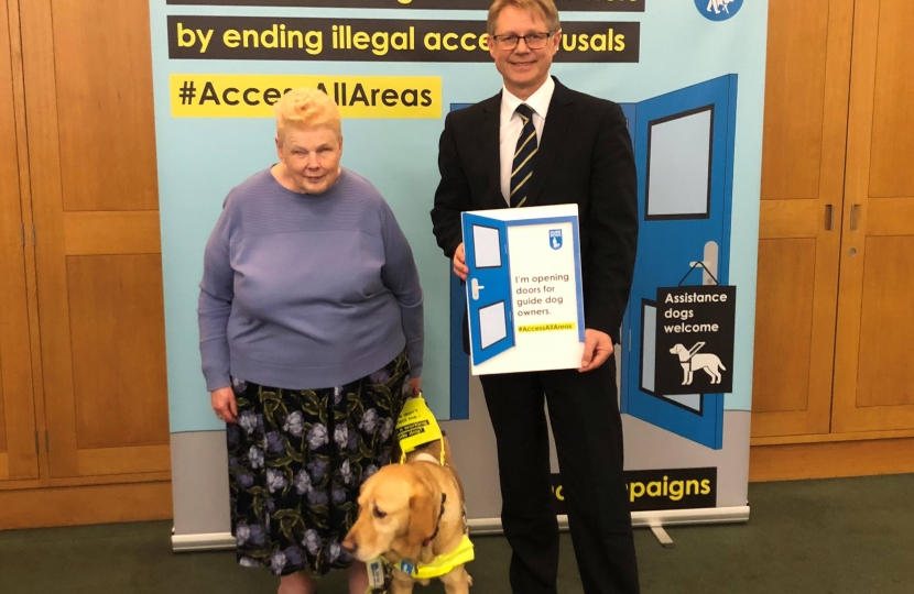 guide dog with David Morris MP 